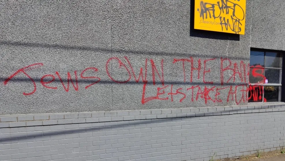 Portland, Ore. -- "Jews own the banks let's take action!!" spray-painted onto the office of a local organization in June.