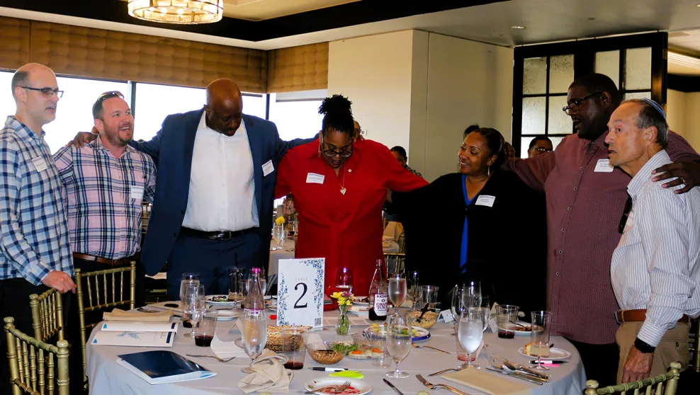 Attendees at the Together Towards Freedom Black Jewish Passover Seder singing  ‘We Shall Overcome’ together